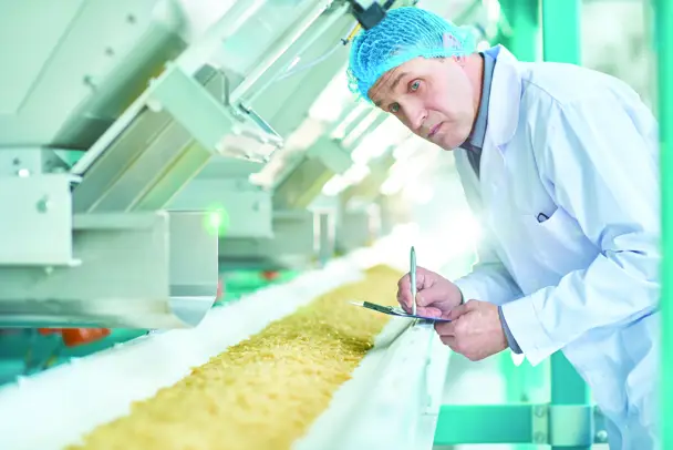Allergen management specialist surveys food line