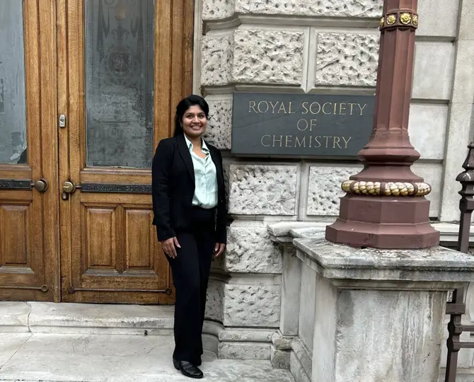 Anitha Raj in front of Royal Society of Chemistry after passing her QP Viva