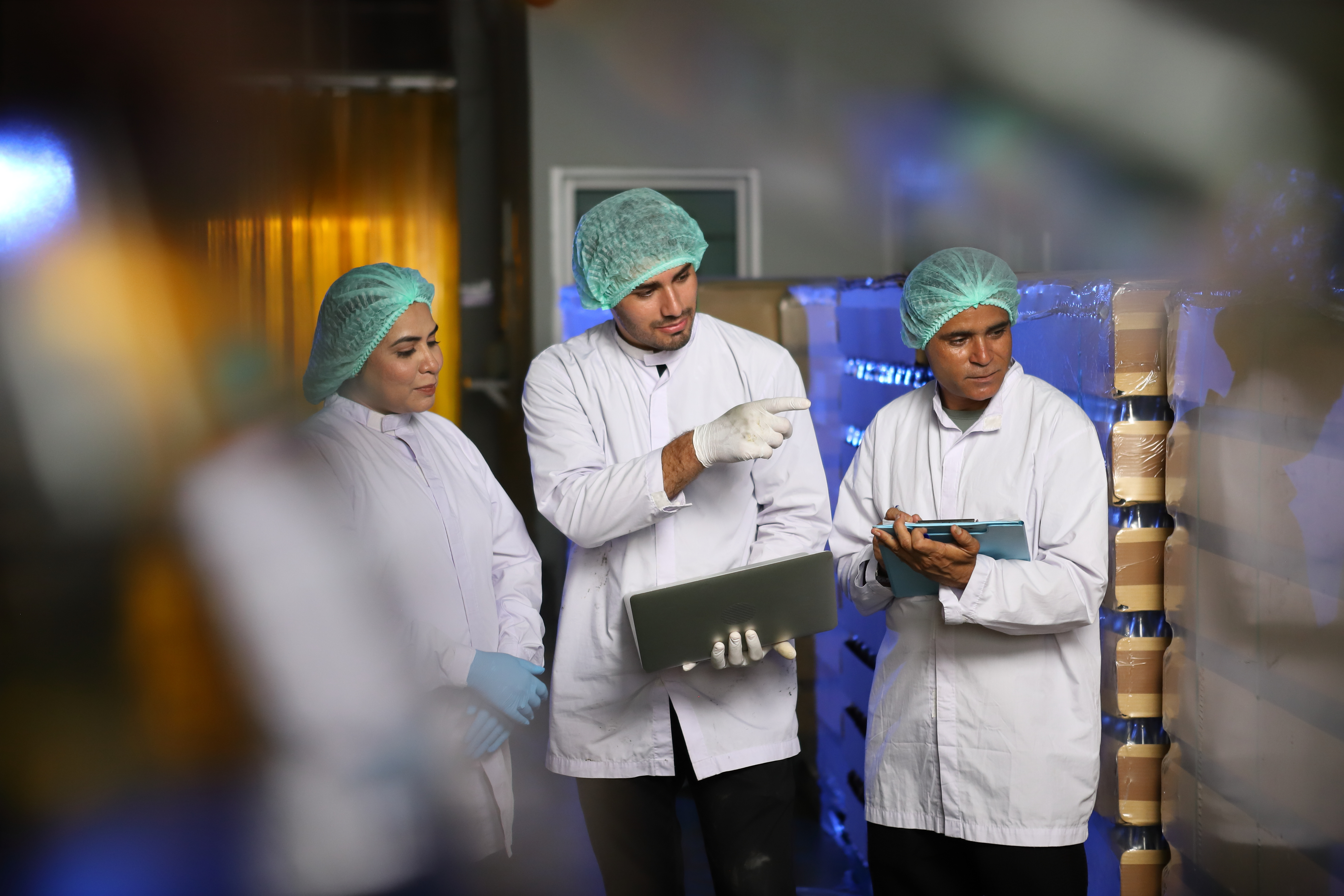 Three allergen management consultants reviews a factories allergen management plan