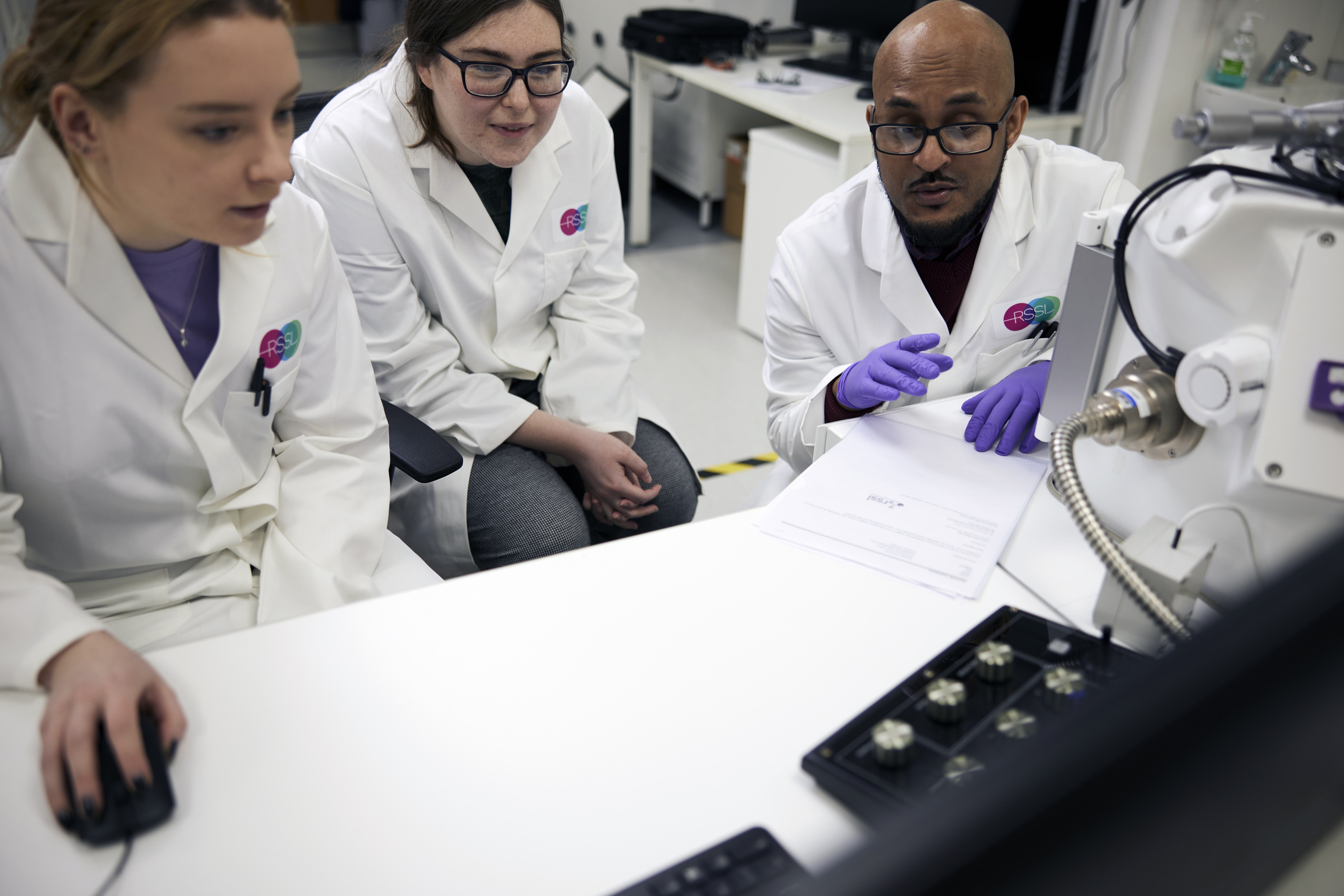 Scientists At An SEM