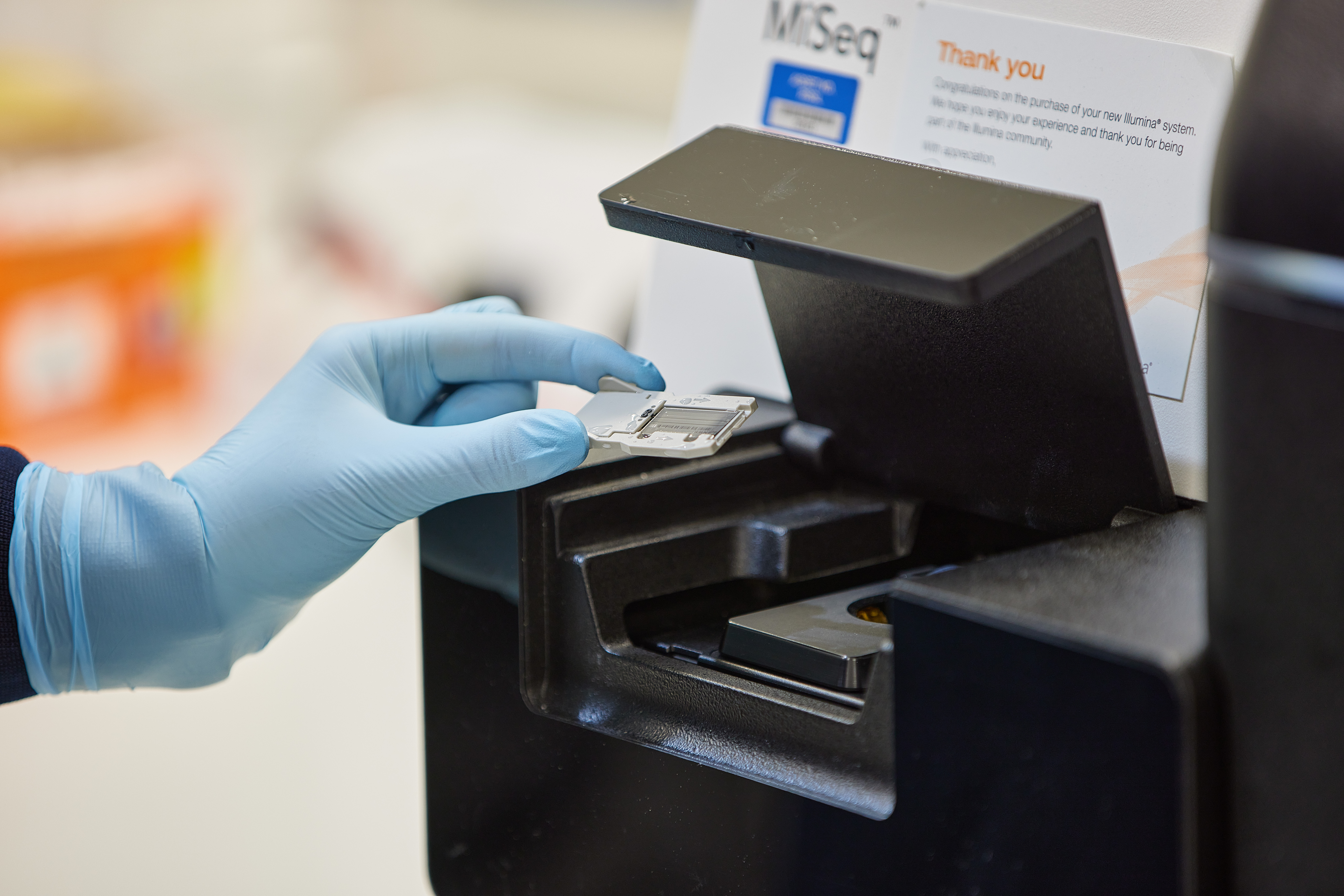 Scientist Performing Next Generation Sequencing On A Miseq